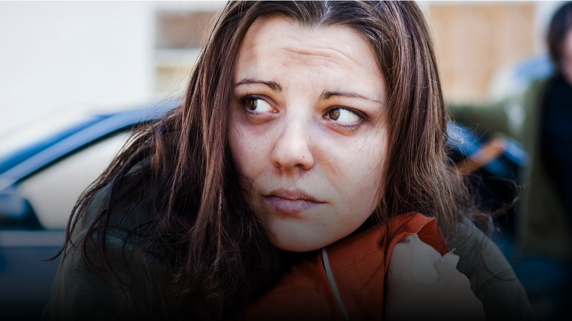 woman looking over her shoulder