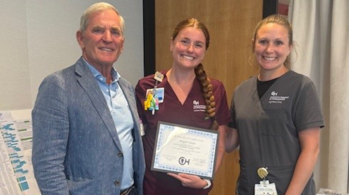 Abigail with her clinical award.