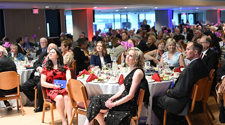 centennial attendees listening to a speech
