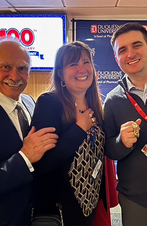 Rocky Bleier, Tina Rozic, and Matt Rozic with Super Bowl rings