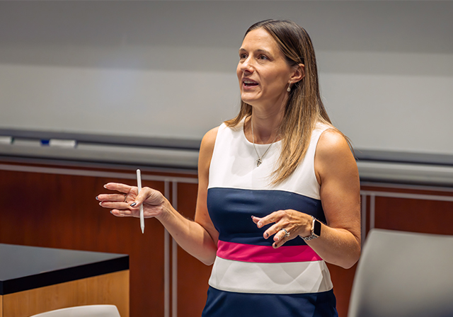 professor teaching in classroom with students