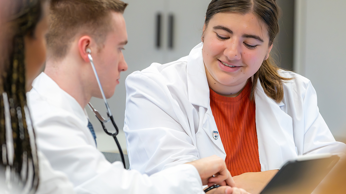 2 pharmacy students in a blood pressure assessment