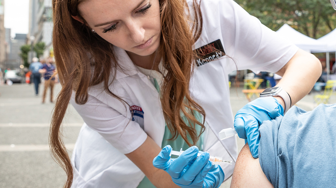 Resident giving a flu shot