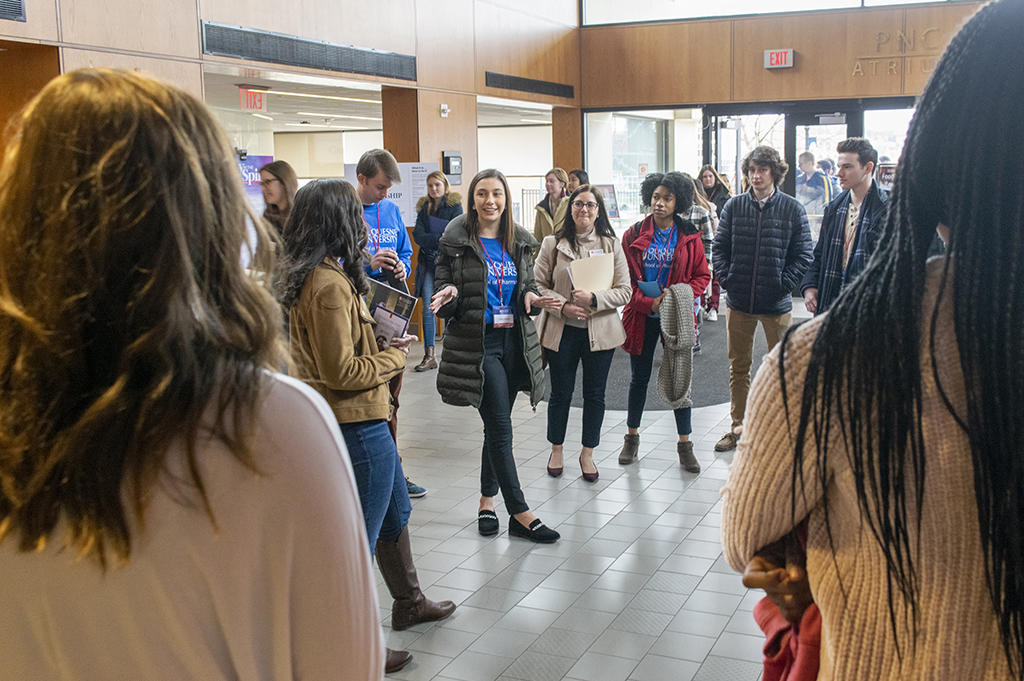 Duquesne University School of Pharmacy student talking to prospective students and families at Accepted Students Day