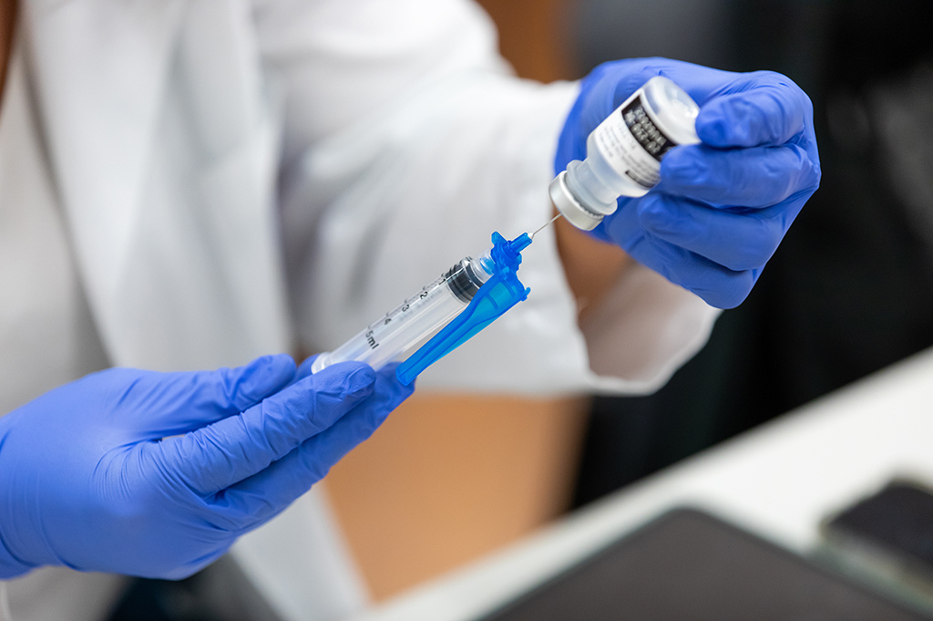 Pharmacist holding immunization