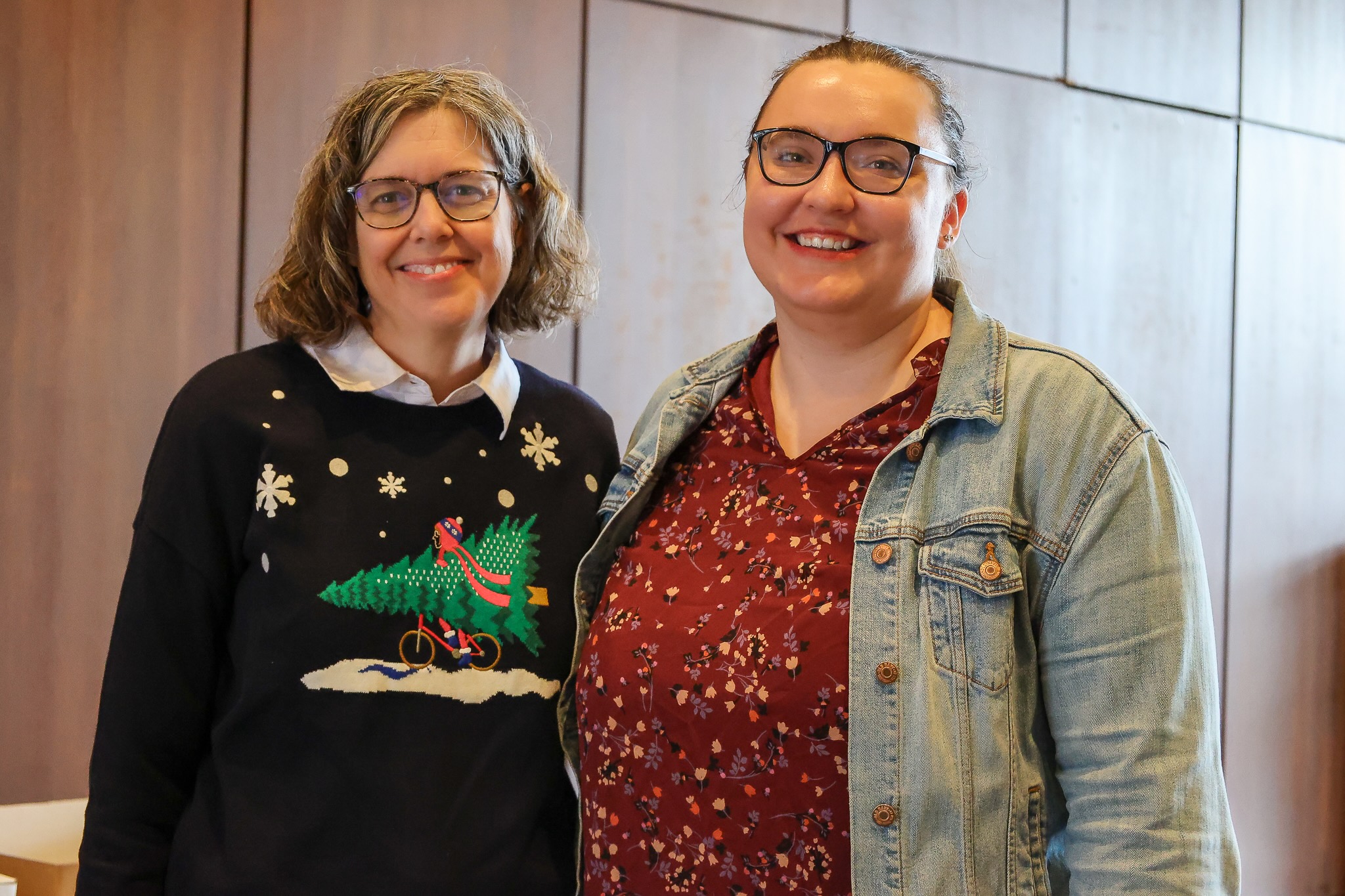 a boy and girl with coffee and a donut