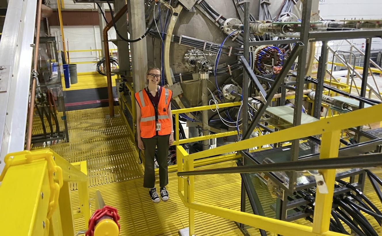 a girl with goggles and a yellow jacket