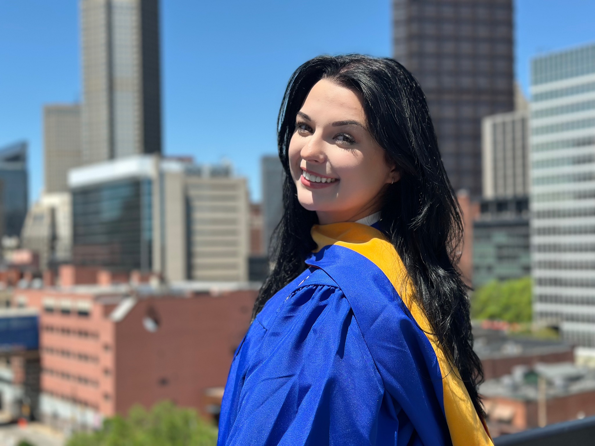 a girl in a graduation cap and gown