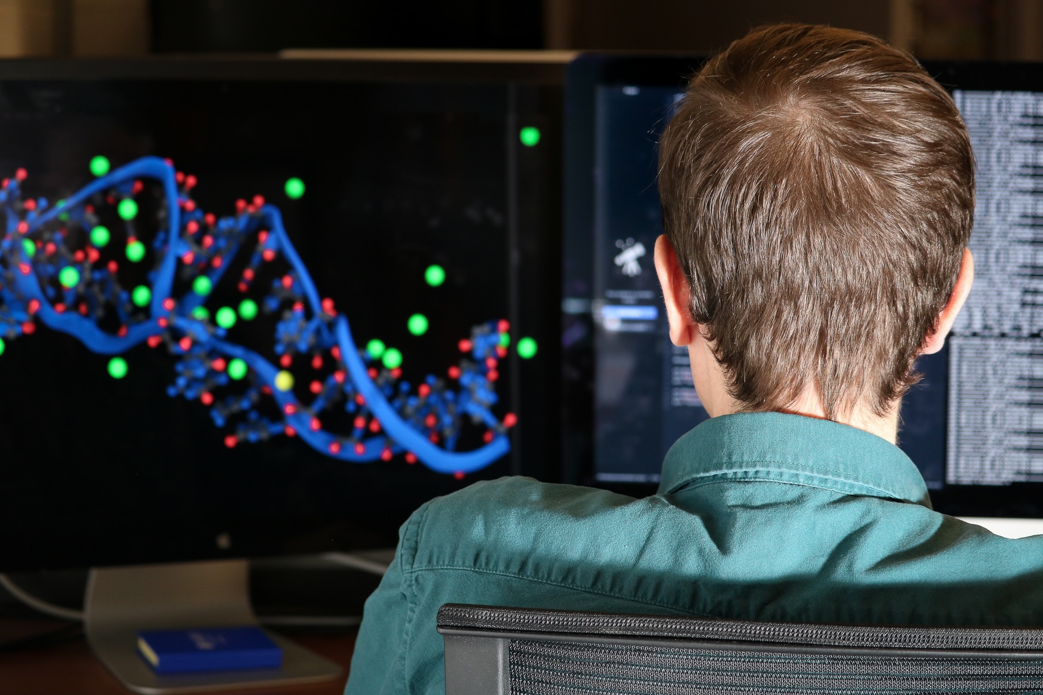 a male looking at a computer