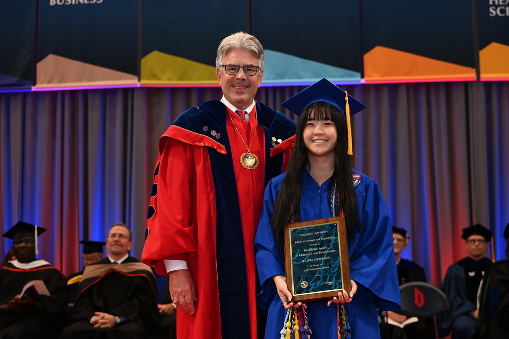 two people in caps and gowns