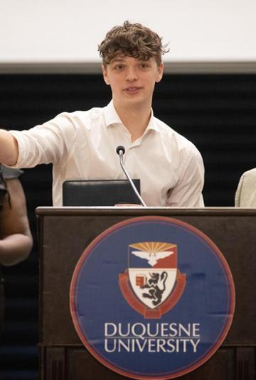 Owen Michener at podium