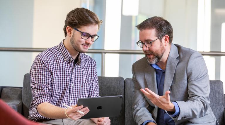 A Duquesne student meeting with a student success coach