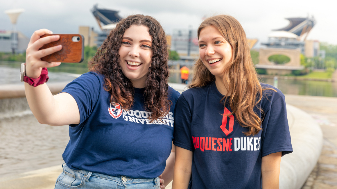 students taking a selfie at the point