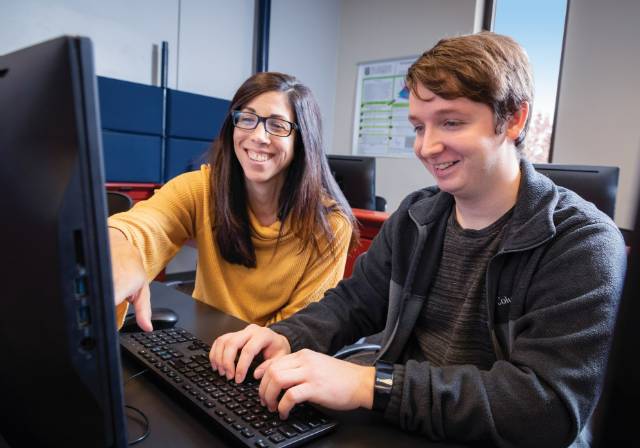 professor and student in computer lab