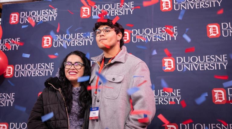 boy and woman with confetti 