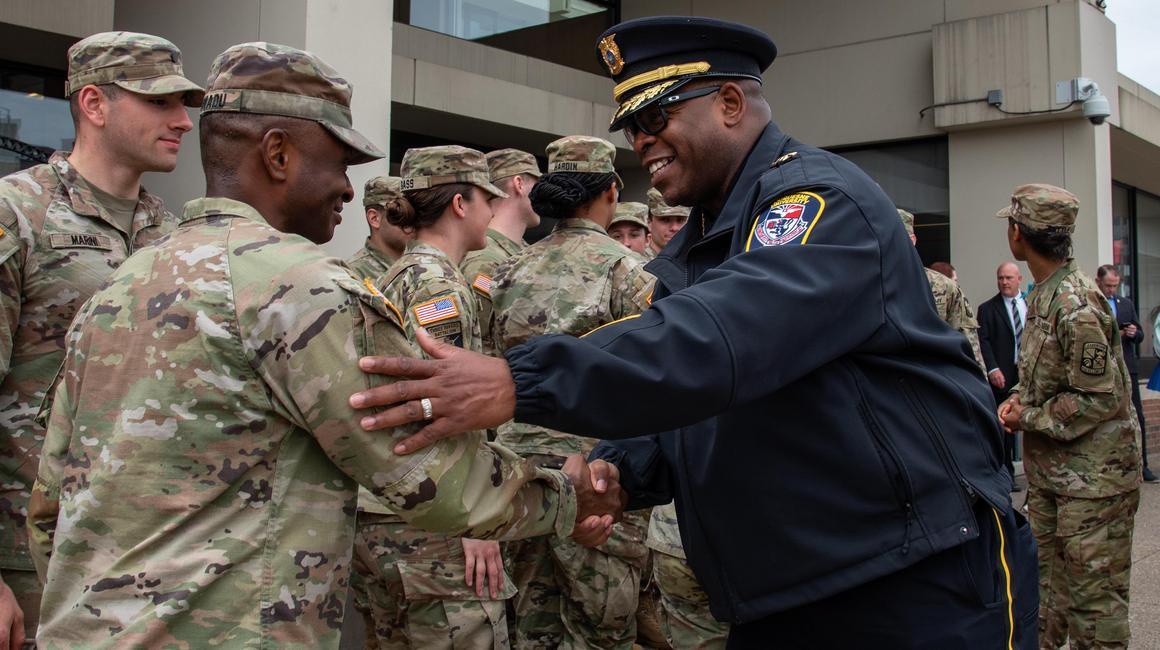 chief holmes greets veterans on campus