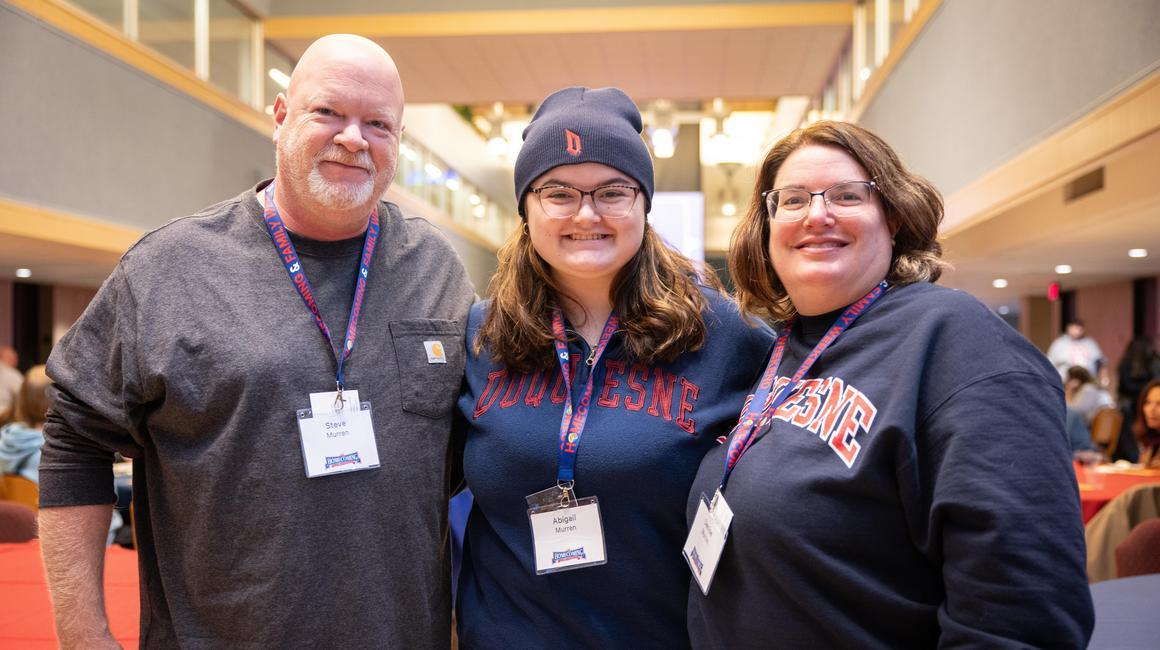 Student and her family at parents weekend bingo night