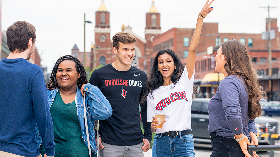 Students having fun in Duquesne shirts