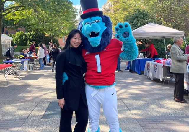 Student with mascot Duke at DUQ Day