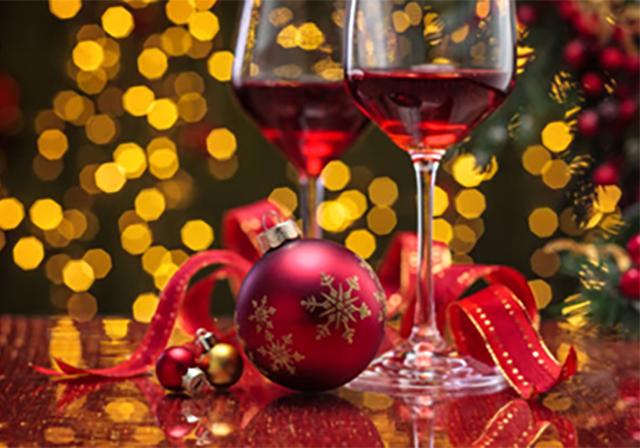 Image of holiday ornament and wine glass