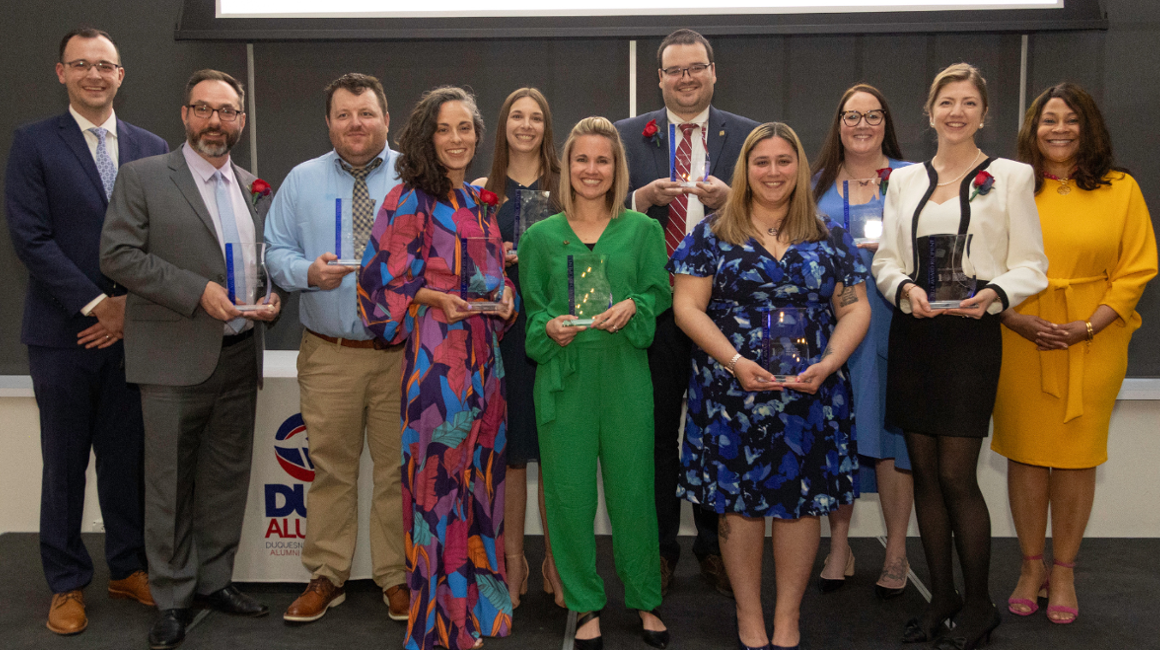 Awardees of the 2024 Dukes from the Last Decade awards standing together holding their awards