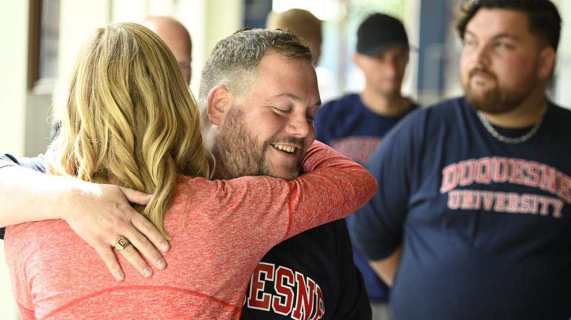 Two people hugging