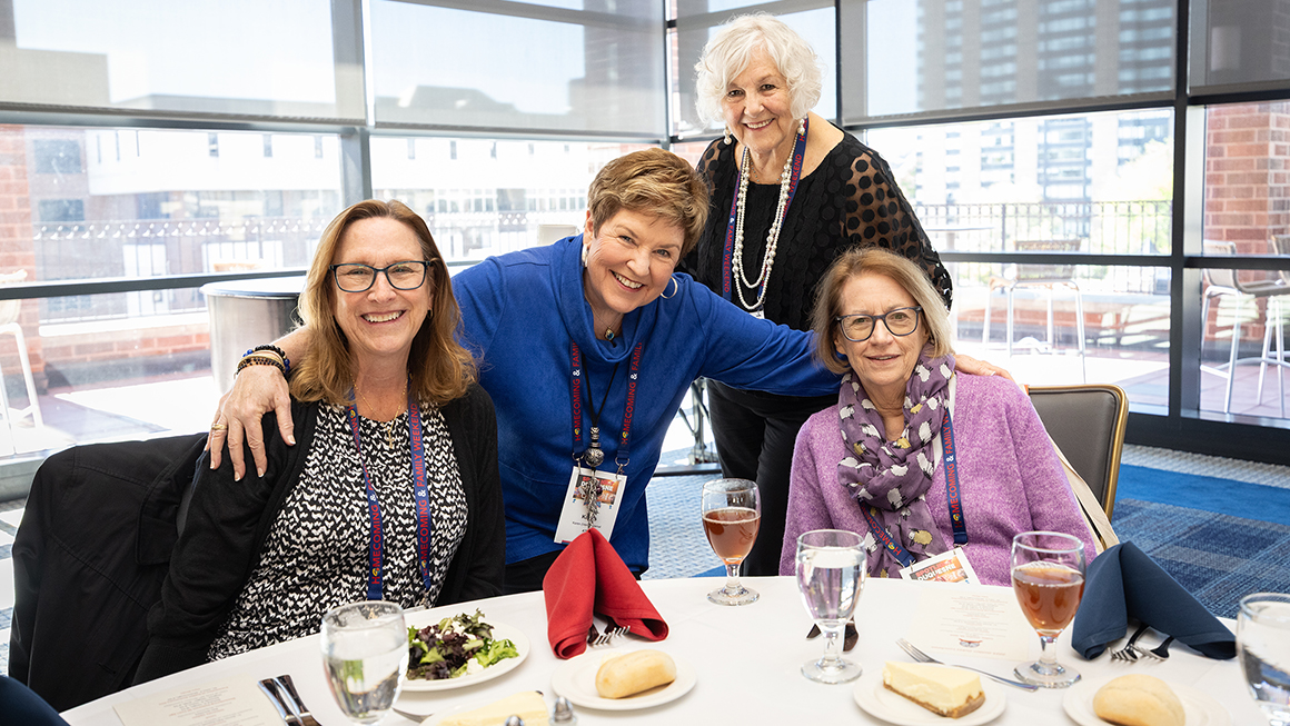 Four alumni enjoying Golden Dukes Luncheon