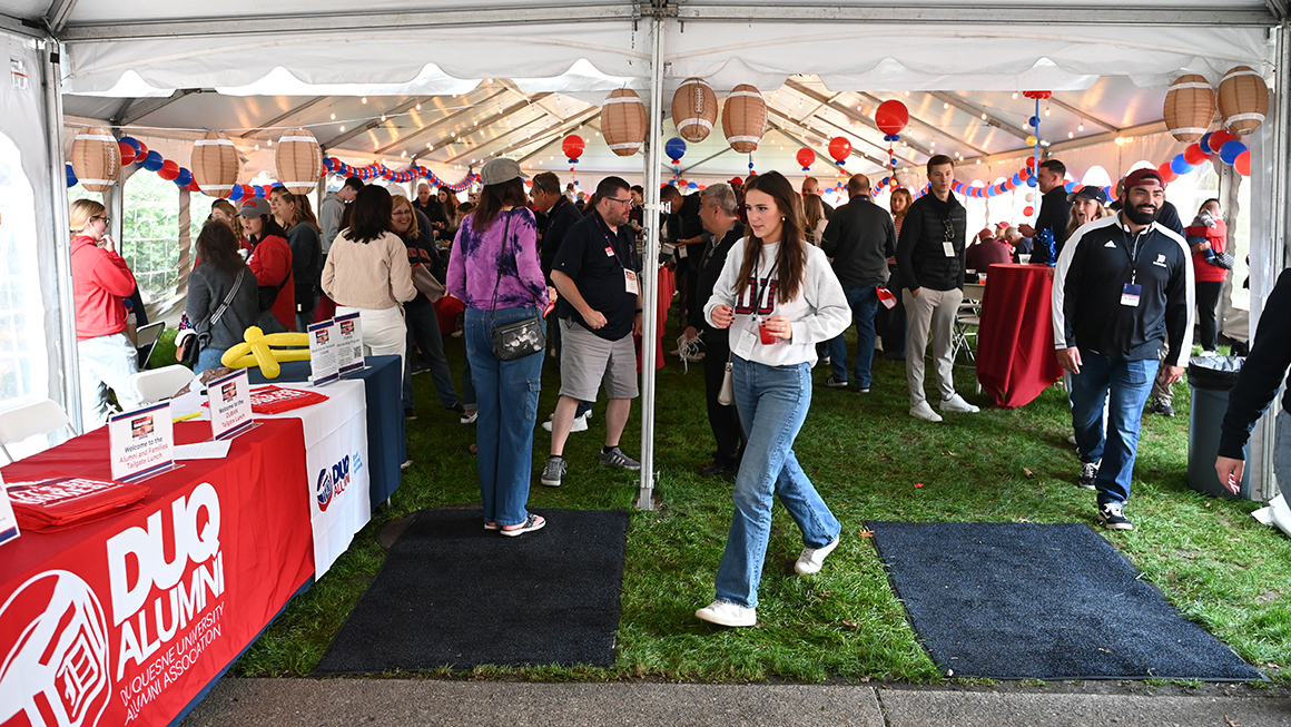 Alumni and families gathered in pre-game tailgate tent
