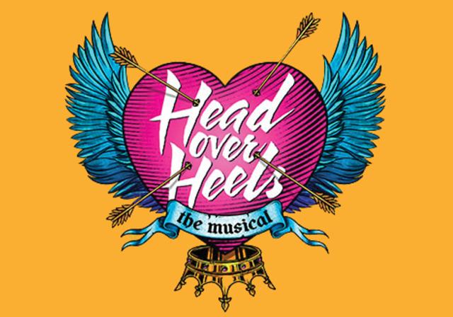 Head Over Heels the Musical written inside a heart with wings and swords. 