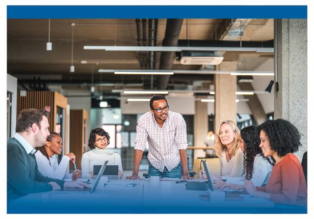 A diverse group of people at a meeting.