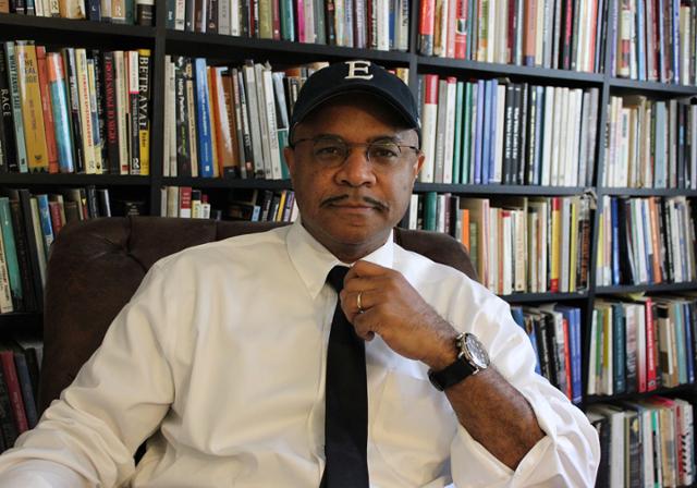 George Yancy in front of a book shelf. 