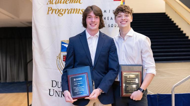 Students holding awards