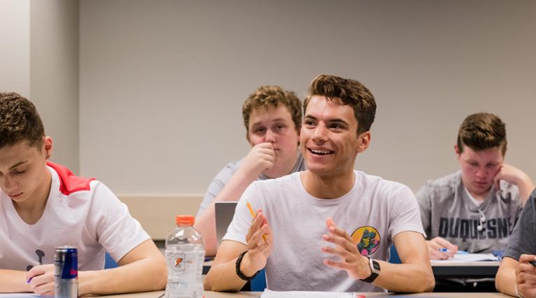 Gussin student smiling in class