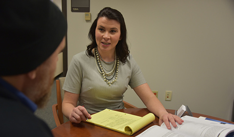 Dr. Kristen Coopie working with student at Pre-Law Center