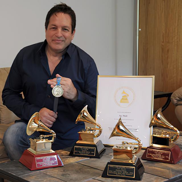 Jay Dudt poses with his GRAMMY awards.