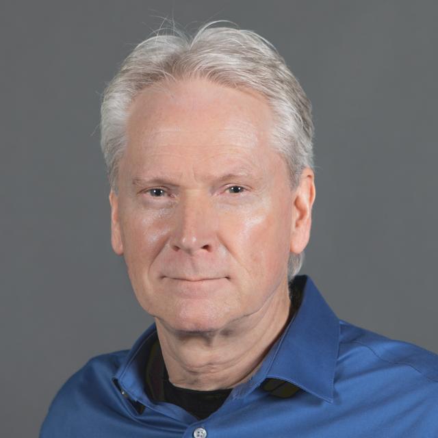 Professional headshot of Dr. William Gibbs