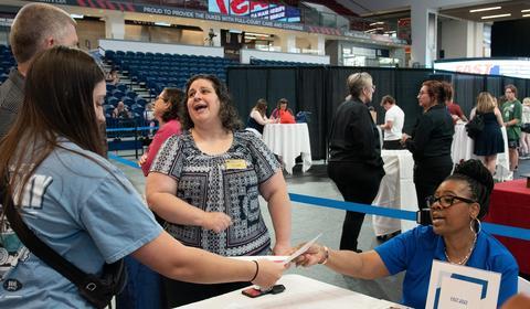 Student Success Coaches assisting a Duquesne family at FAST 2023.