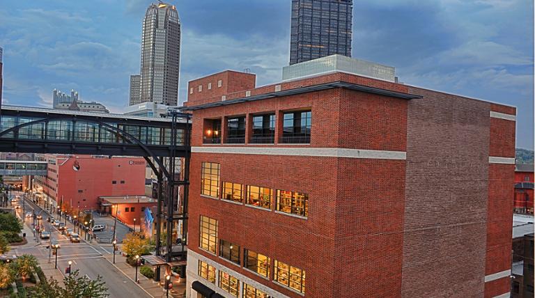 View of Power Center with downtown buildings in background