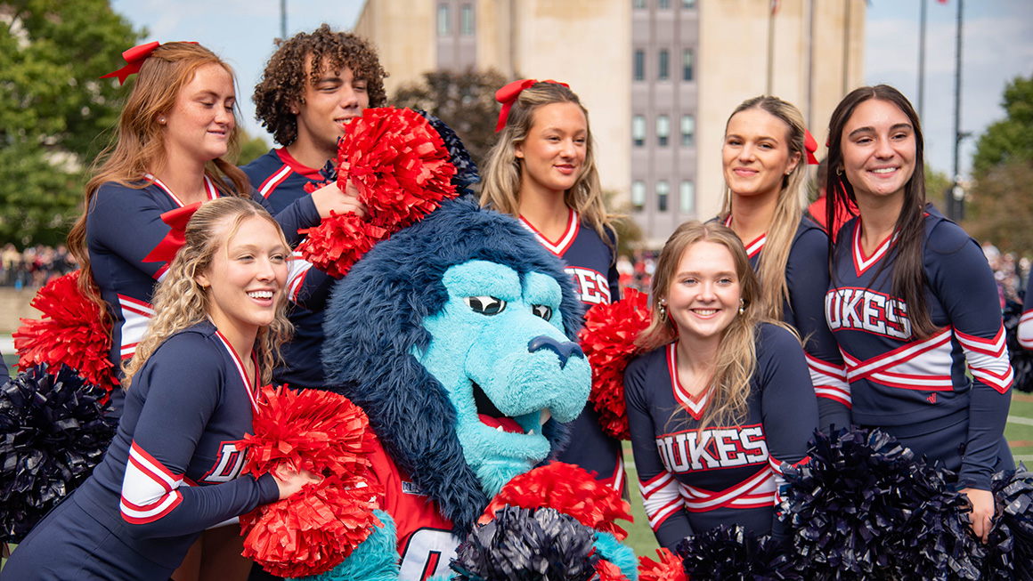 Duquesne cheerleaders with the University mascot