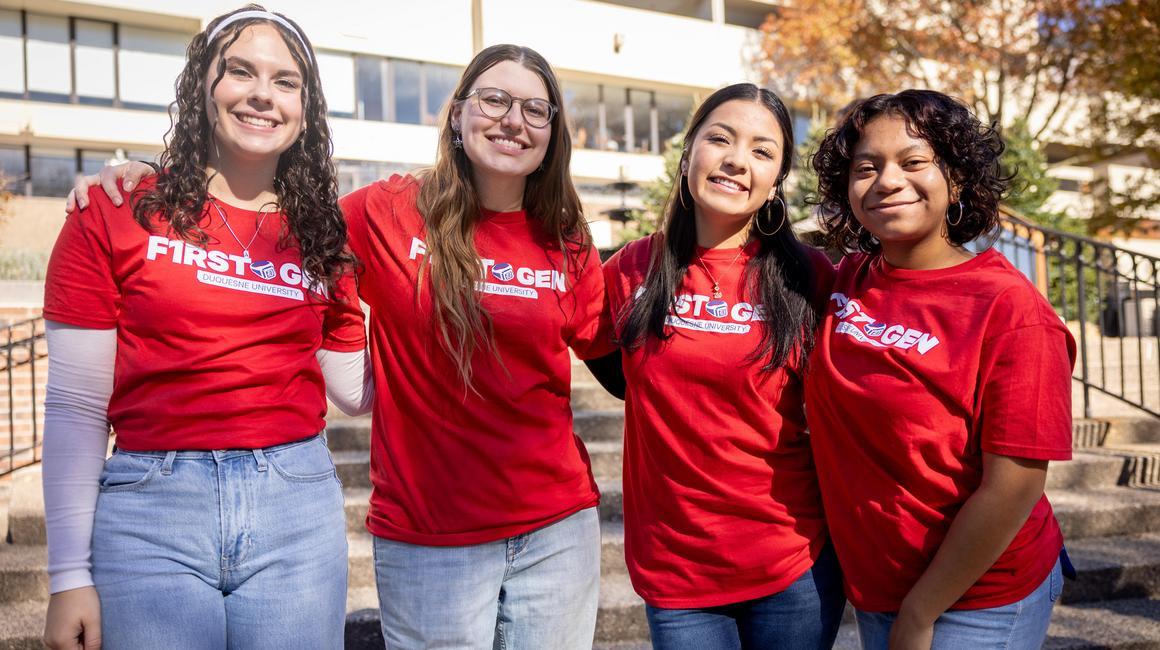 Four first-gen students at a first-gen celebration event