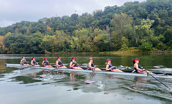 Amelia Nicholas and the Duquesne Rowing Team practice on the river