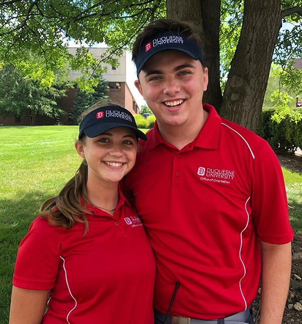 Daniel dressed in red Orientation team leader polo shirts