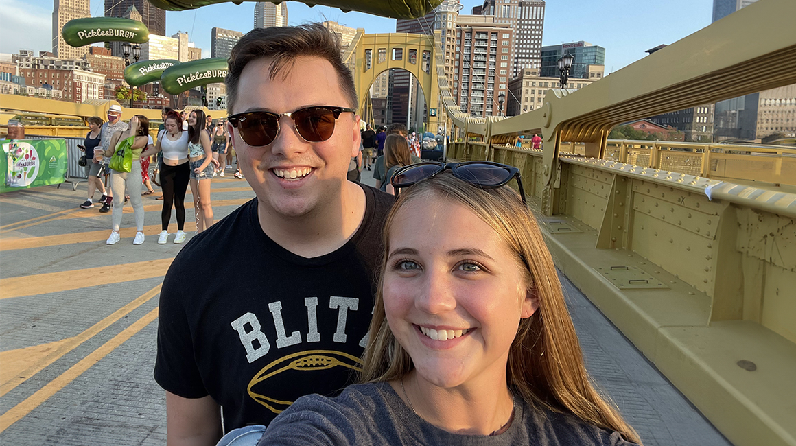 Duquesne alumni Daniel and Riley Smolsky at Picklesburgh on the Andy Warhol Bridge, also known as the Seventh Street Bridge, in Pittsburgh