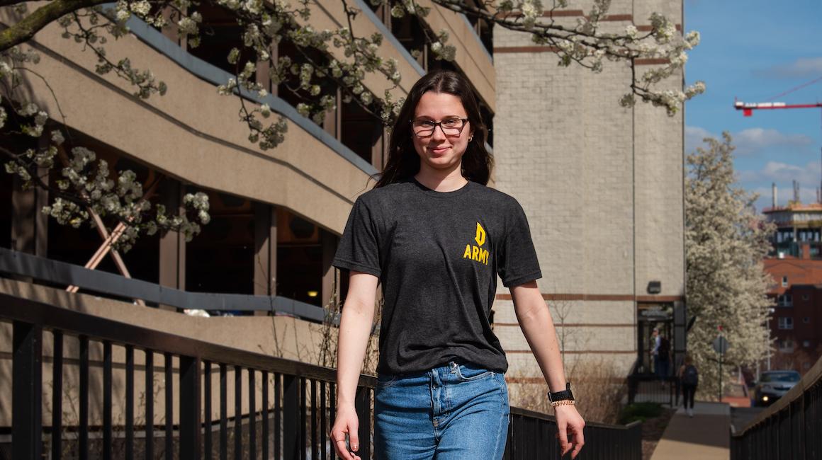 duquesne student standing on campus and smiling