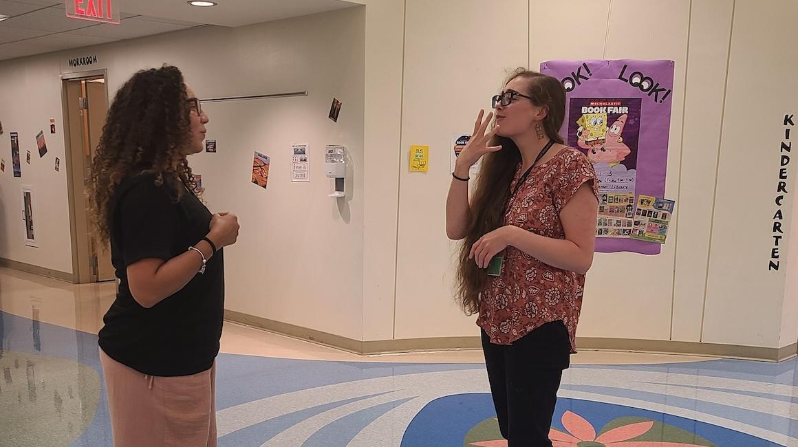 Brooke Yurick using sign language