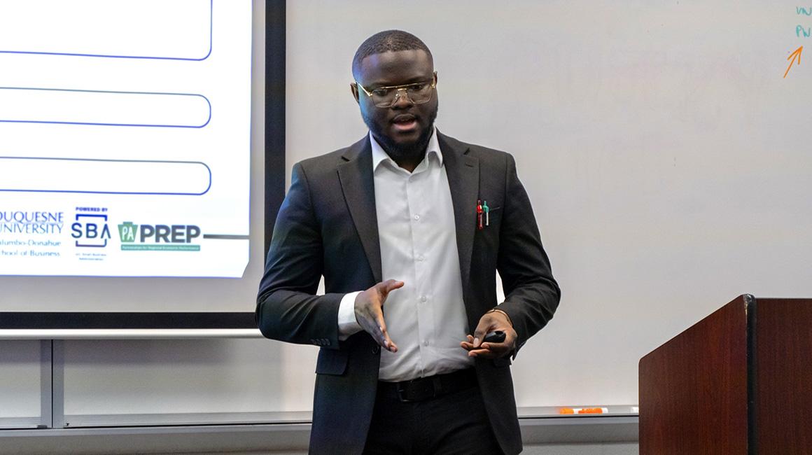 Jeromy Lamya leads a presentation for the SBDC