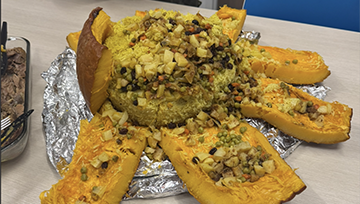 A pumpkin stuffed with rice and vegetables.