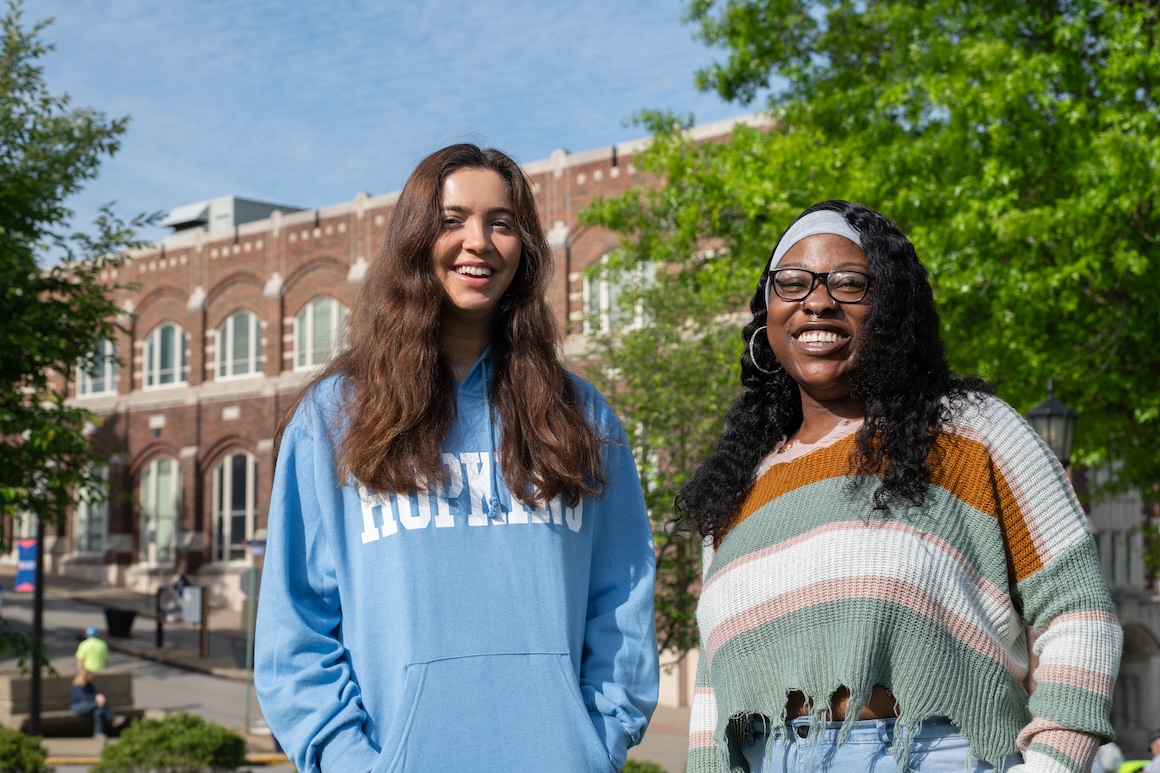 Kozosey and Smith outside on campus