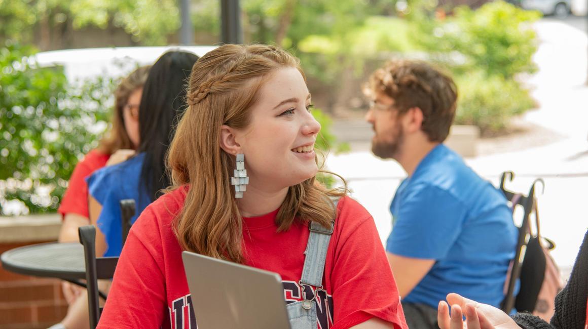 Skyler Wrubleski talking to peers on campus