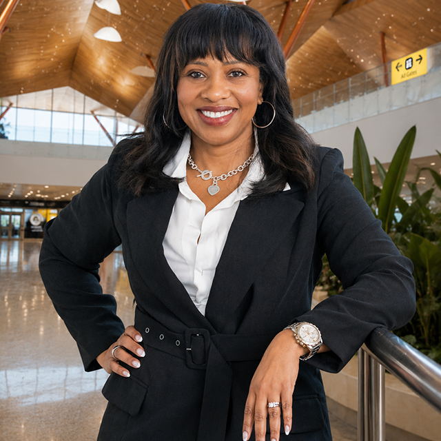 Tracie McCormick stands in the Pittsburgh International Airport terminal